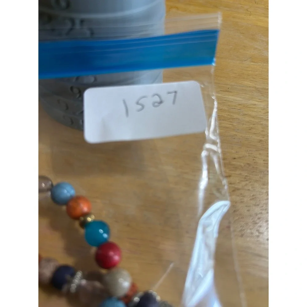 Set of 2 Multi Color Beaded Stretch Bracelets  Silver Wing Charm
